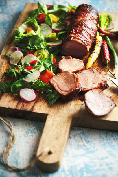 istock Roasted Pork Filet with Bacon and Green Salad 1405670004