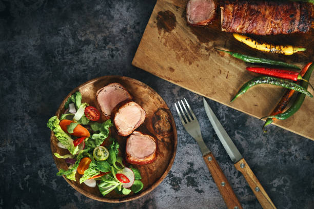 istock Roasted Pork Filet with Bacon and Green Salad 1405670029
