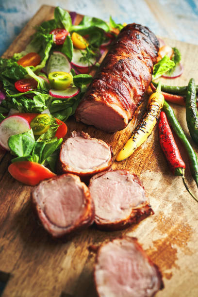 istock Roasted Pork Filet with Bacon and Green Salad 1405670045