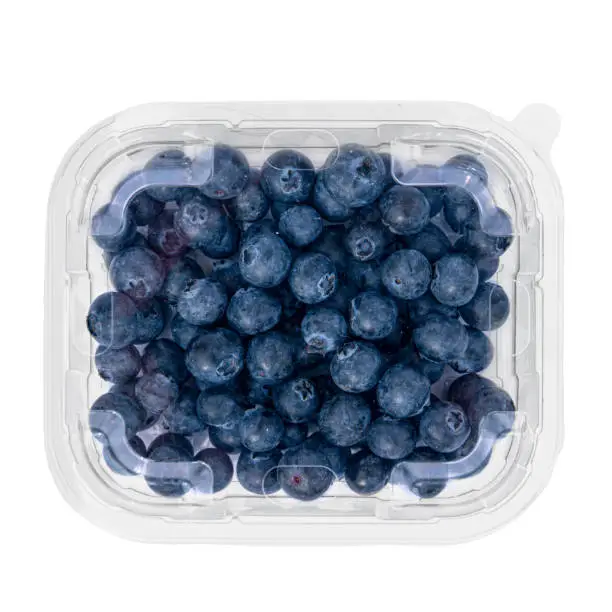 Photo of Transparent tray with blueberries for sale.