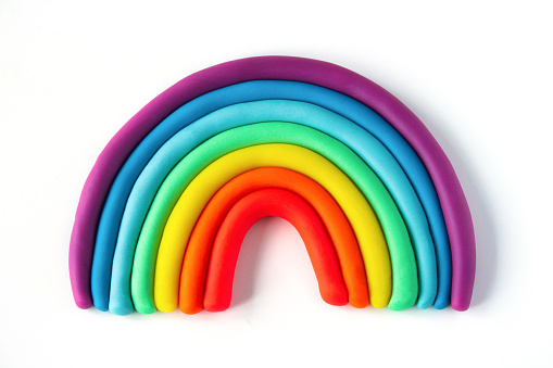 Colorful rainbow of plasticine on white background. Made from plasticine. Isolate.