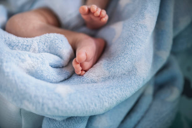 istock Baby boy feet. 1405672840