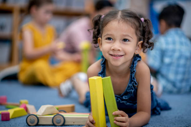 istock Young Girl Playing with Blocks 1405673140