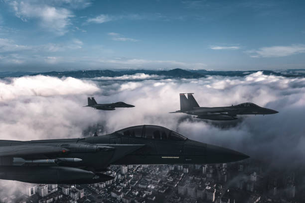 istock Jet fighters flying over the clouds. 1405674631