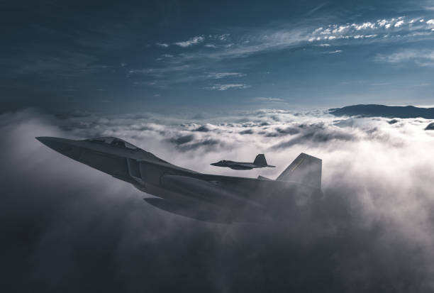 istock Jet fighters flying over the clouds. 1405675386