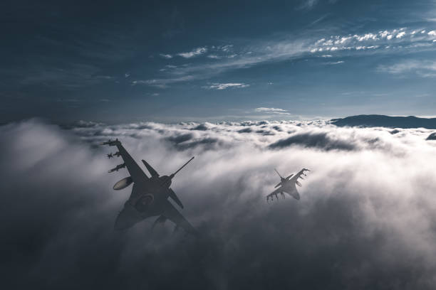 istock Jet fighters flying over the clouds. 1405675490
