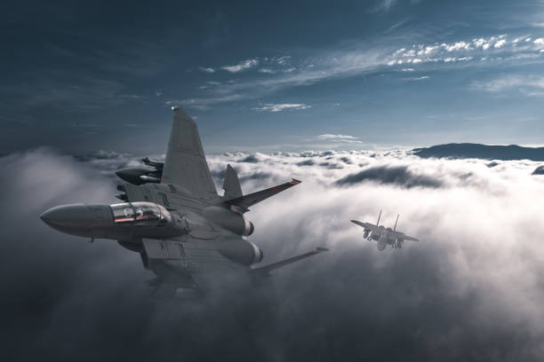 istock Jet fighters flying over the clouds. 1405675624