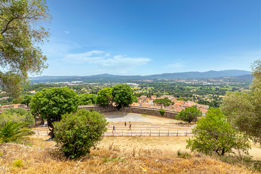 View of the medieval village and French Provencal countryside of Grimaud France from the medieval castle on the hill, Chateau de Grimaud.