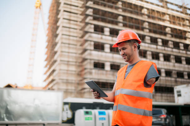 Blue collar worker with disability working on the construction stock photo