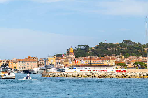 View from the Mediterranean sea of the harbor at Saint-Tropez, France, along the Cote d'Azur French Riviera.