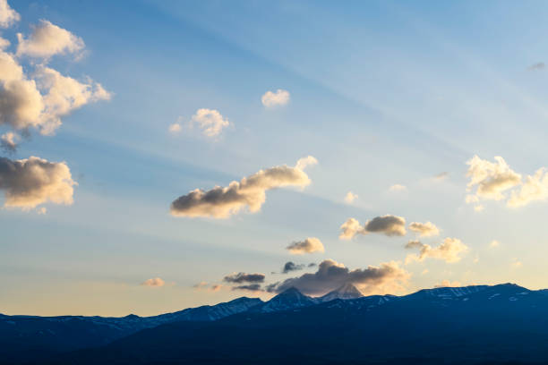 Sunset over the silhouette mountains.