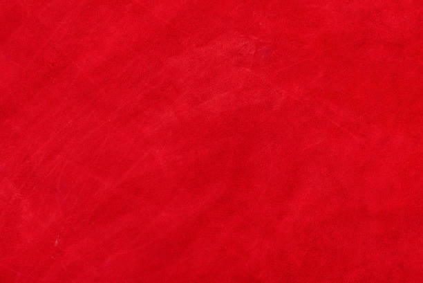 Red suede genuine leather background. Velvet red background close-up photo. stock photo