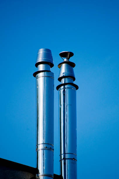 flue gas chimneys made of stainless steel. - flue gas imagens e fotografias de stock