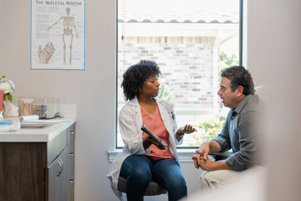 istock Doctor explains test results to male patient 1405683447
