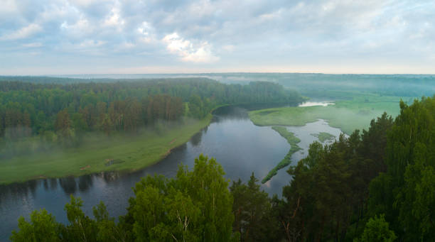 istock Aerial panoramic landscape with sunset over the river and beautiful clouds on the sky. 1405684825