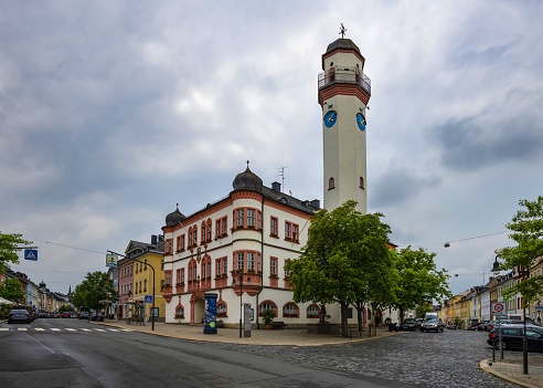 Hof, Germany, June 4, 2022: Low angle view of the city hall in the Bavarian town of Hof under cloudy spring sky. Hof with 47.000 inhabitans is situated in the Franconian region, at the Czech border.