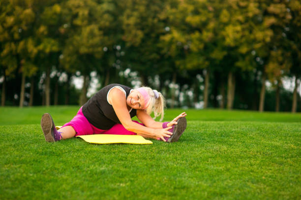 istock Senior woman is stretching. 1405685918