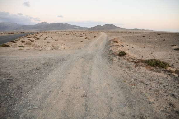 istock Countryside Desert Dirt Road 1405686637