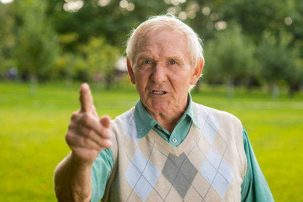 istock Senior man threatens with finger. 1405688081