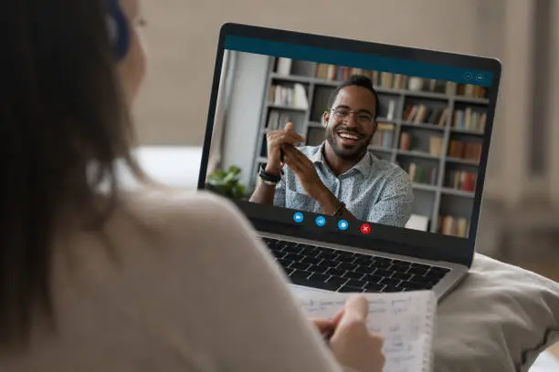 Photo of Student girl in headphones making video call