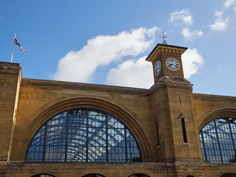Kings Cross railway station facade with a clock tower. London, England, United Kindgom, Europe