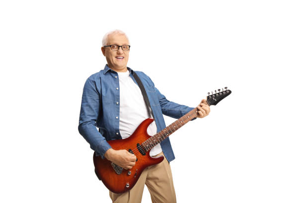 istock Mature man with an electric guitar standing and smiling 1405690726
