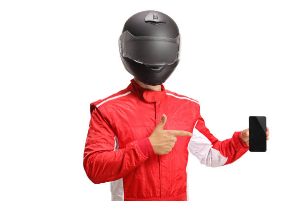 istock Racer with a helmet holding a phone a smart phone and pointing 1405690849