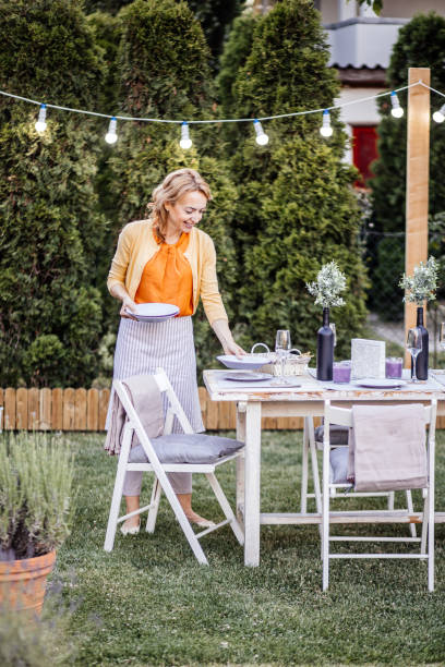 istock Woman serving outdoor party table 1405691153