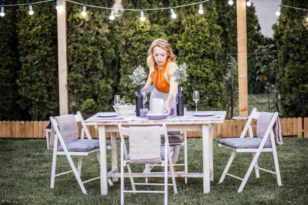 istock Woman serving outdoor party table 1405691195