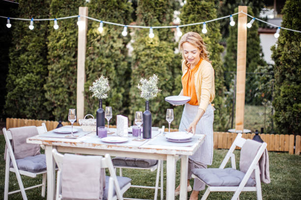 istock Woman serving outdoor party table 1405691278