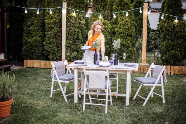 istock Woman serving outdoor party table 1405691291