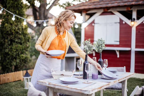 istock Woman serving outdoor party table 1405691323