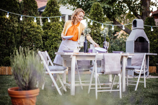 istock Woman serving outdoor party table 1405691324