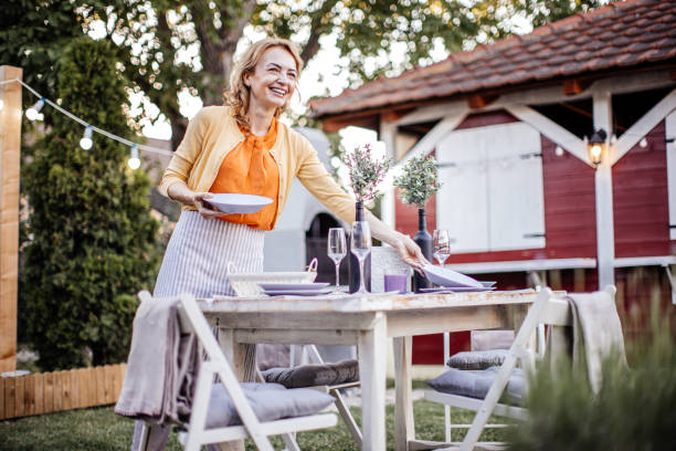 istock Woman serving outdoor party table 1405691347