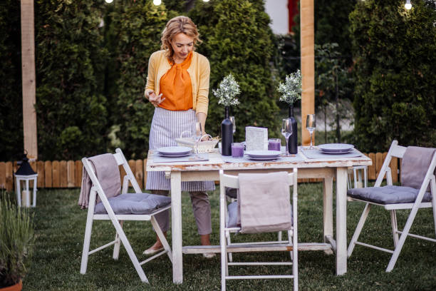 istock Woman serving outdoor party table 1405691476