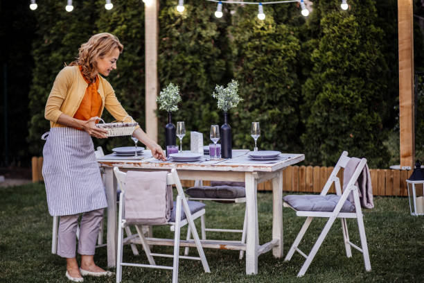 istock Woman serving outdoor party table 1405691563