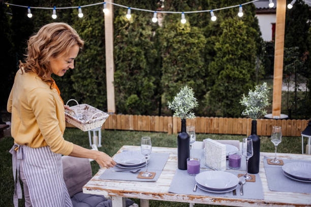 istock Woman serving outdoor party table 1405691616