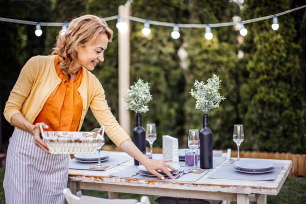 istock Woman serving outdoor party table 1405692146
