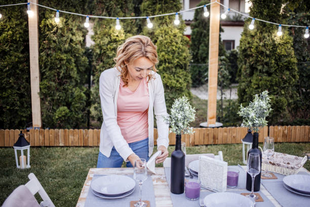 istock Woman serving outdoor party table 1405692293