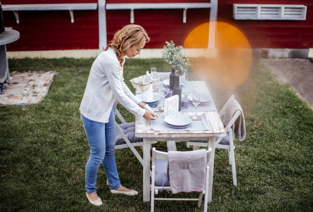 istock Woman serving outdoor party table 1405692345