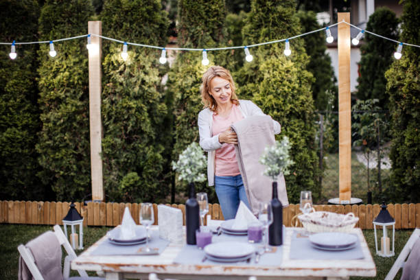 istock Woman serving outdoor party table 1405692383