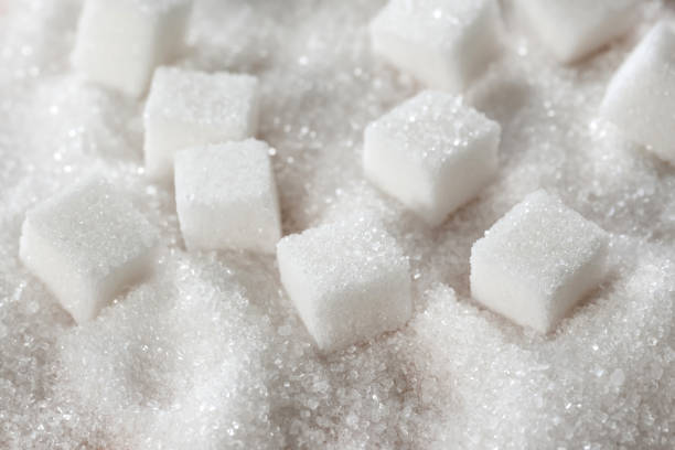 istock White sugar cubes to use as a background. Refined cane sugar 1405692424