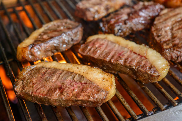 Picanha barbecue with blurred background. This form of barbecue is widely consumed throughout Brazil. stock photo