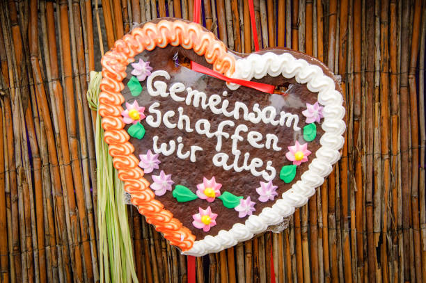 gingerbread heart with german writing - camel fair imagens e fotografias de stock