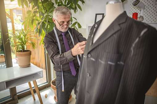 Photo of experienced tailor working on local business