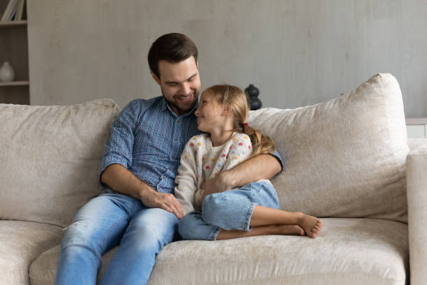 istock Happy bonding young father and small kid talking at home. 1405695770