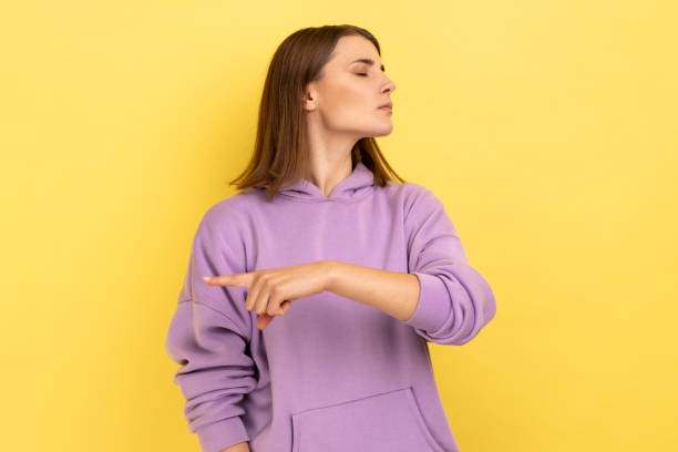 istock Woman showing exit, demanding to leave her alone, has resentful irritated expression. 1405695998