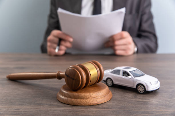 istock Model of car and gavel. 1405696104