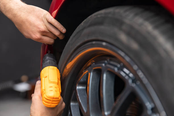 istock Car repair holding drill 1405696106