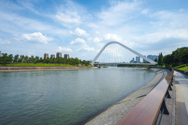 istock Sunny riverside bridge and Financial City 1405699264